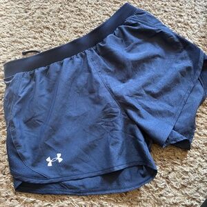 Women’s UA running shorts, navy/black lining, size medium